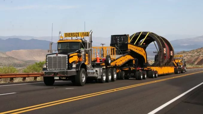 Flatbed truck hauling oversize load