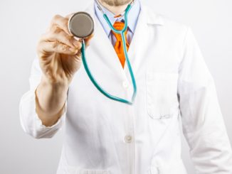 Doctor holding stethoscope for DOT physical