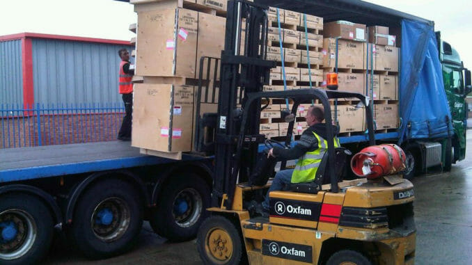 Forklift loading freight into a dry van trailer