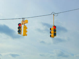 Two hanging red traffic lights
