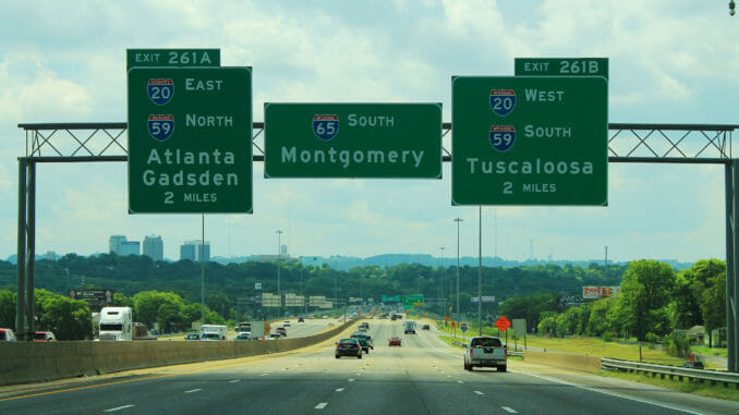 Alabama highway with three signs