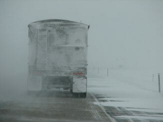 Rear of truck trailer while driving in snowy weather
