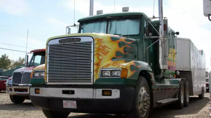 Semi-truck with orange flames painted on