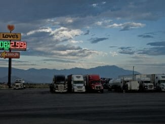 Truck stop with fuel prices in the evening