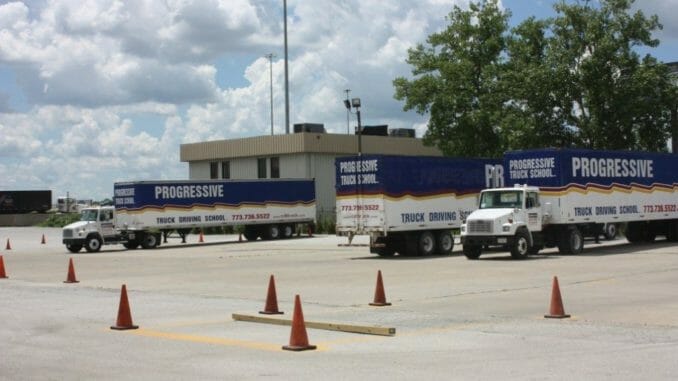 Progressive Trucks in Parking lot of trucking school