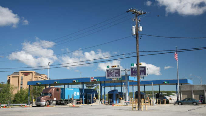 trucks at a tolling plaza